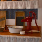 Various kitchen utensils, cookbooks and workspace